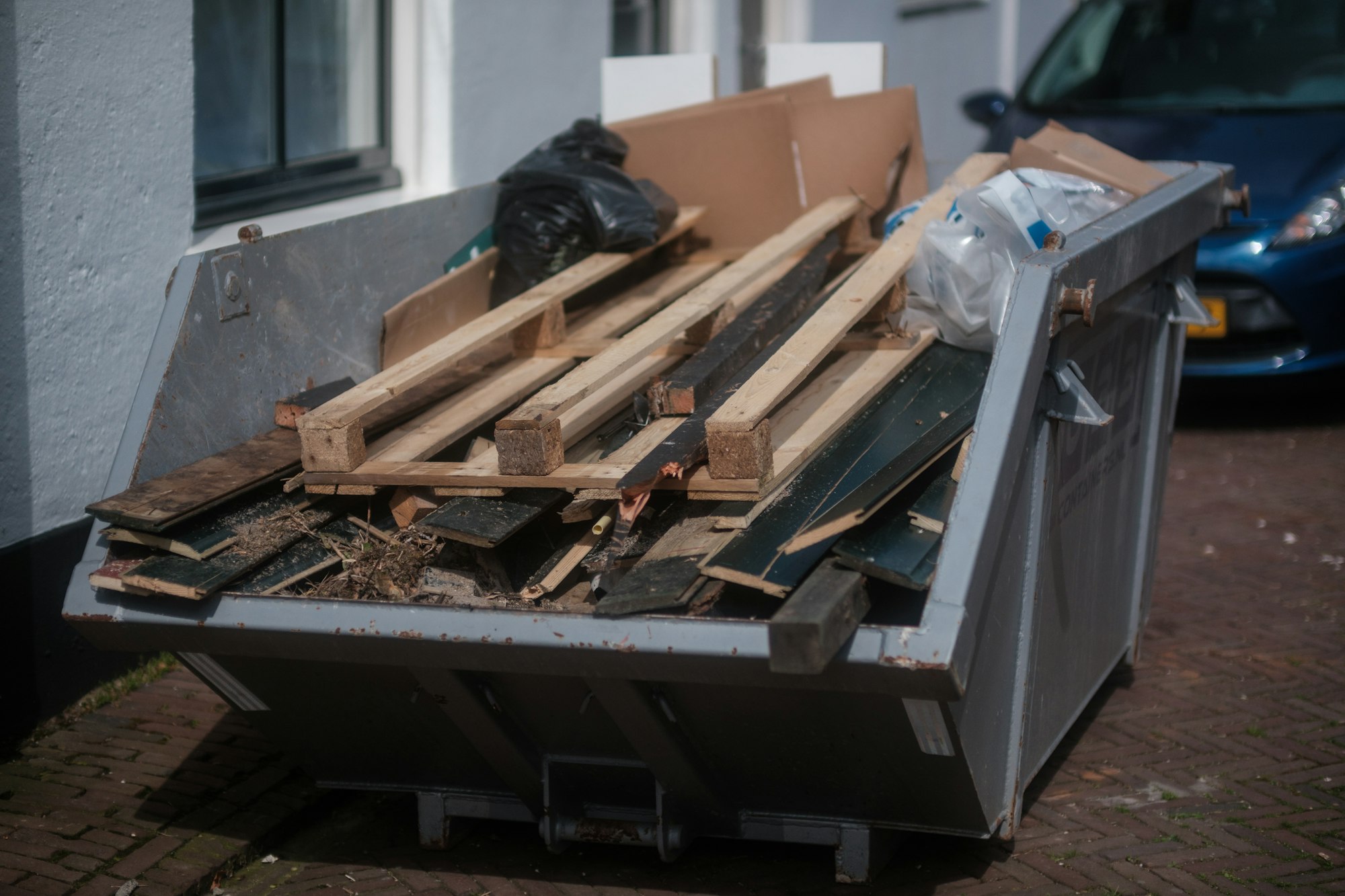 Container filled with wood debris