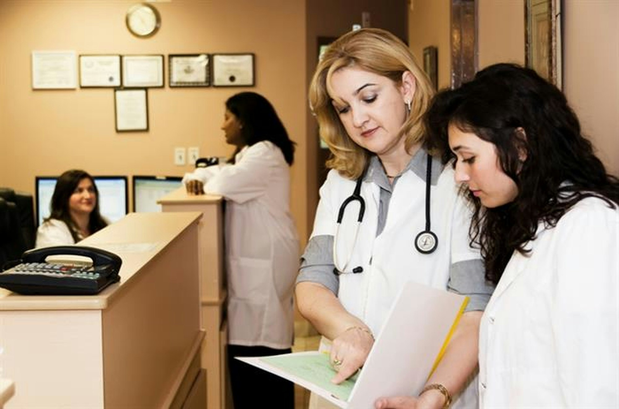 Medical staff working at a practice front desk