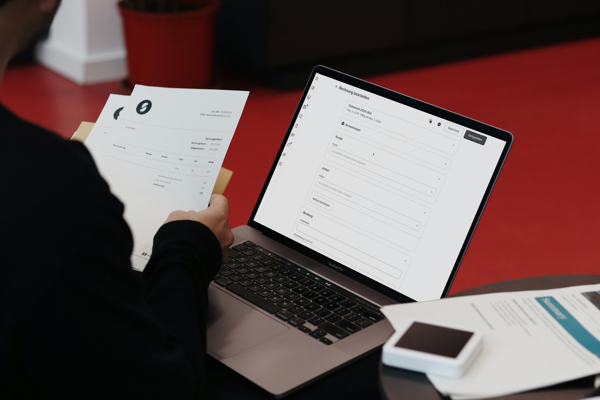 Person reviewing an invoice at a laptop Person reviewing an invoice at a laptop