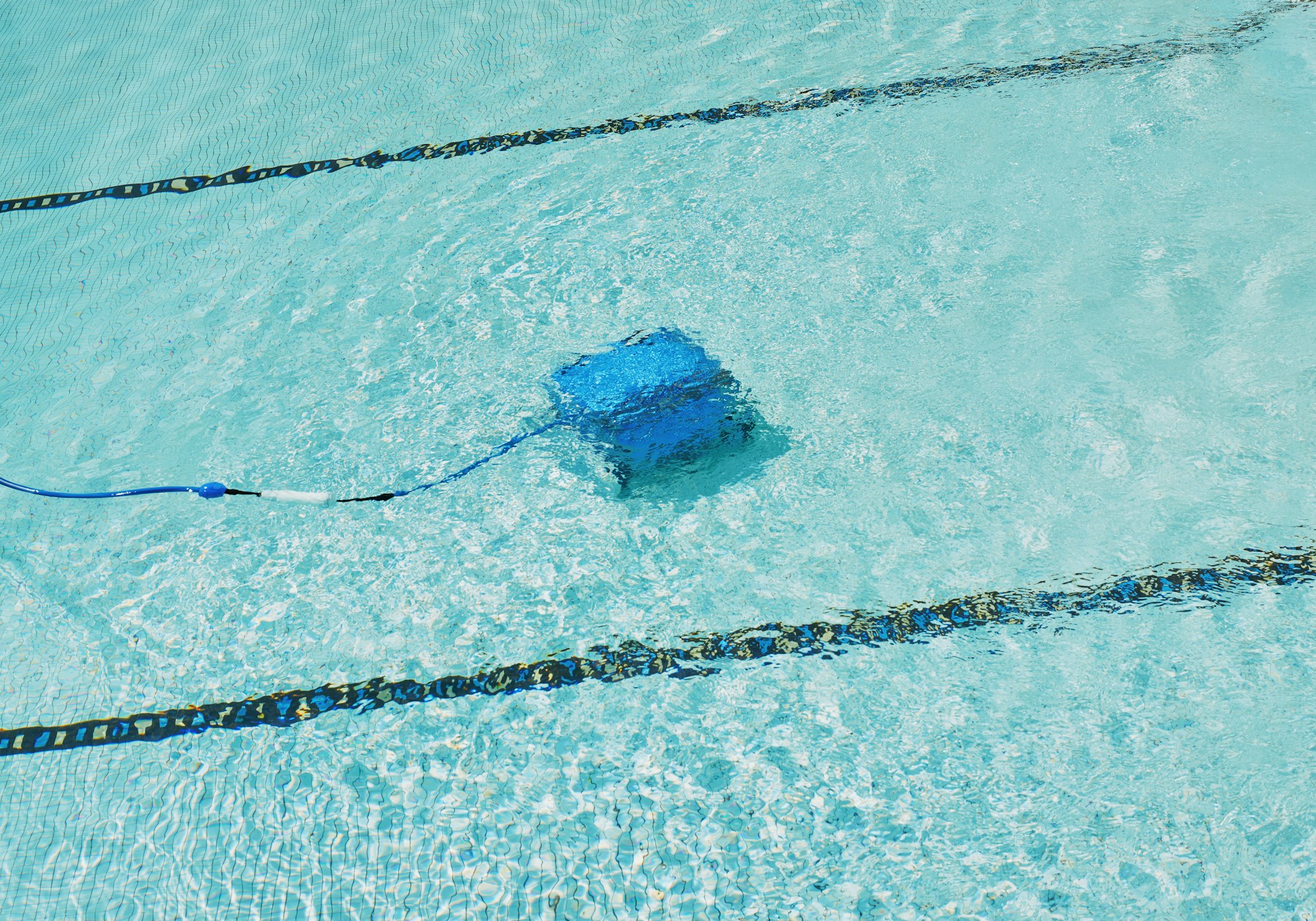 Robotic pool cleaner working underwater Robotic pool cleaner working underwater