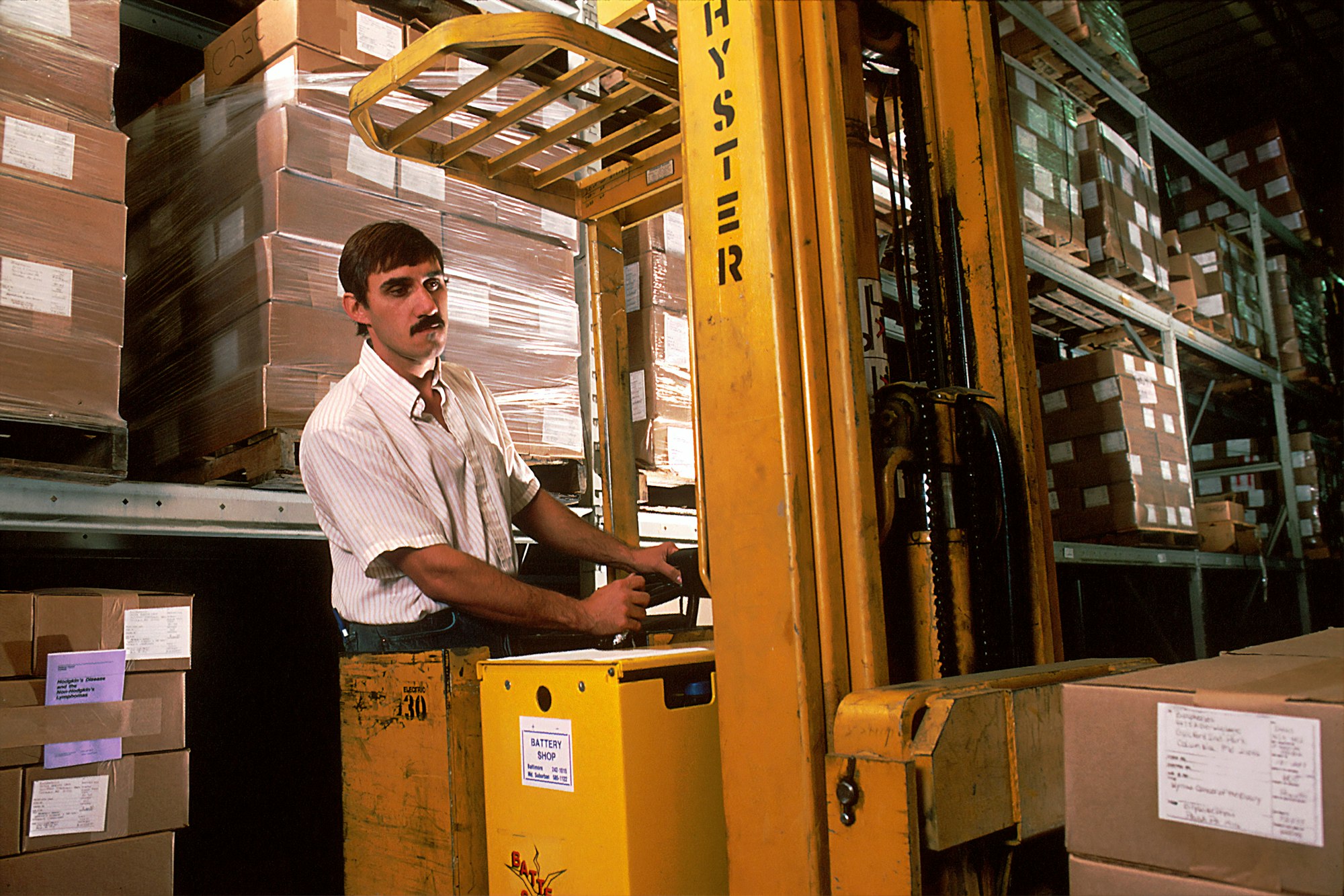 Forklift operator in a distribution warehouse Forklift operator in a distribution warehouse